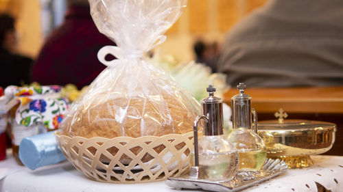 Close-up of wine glass with bottles on table