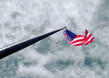 Low angle view of flag against sky