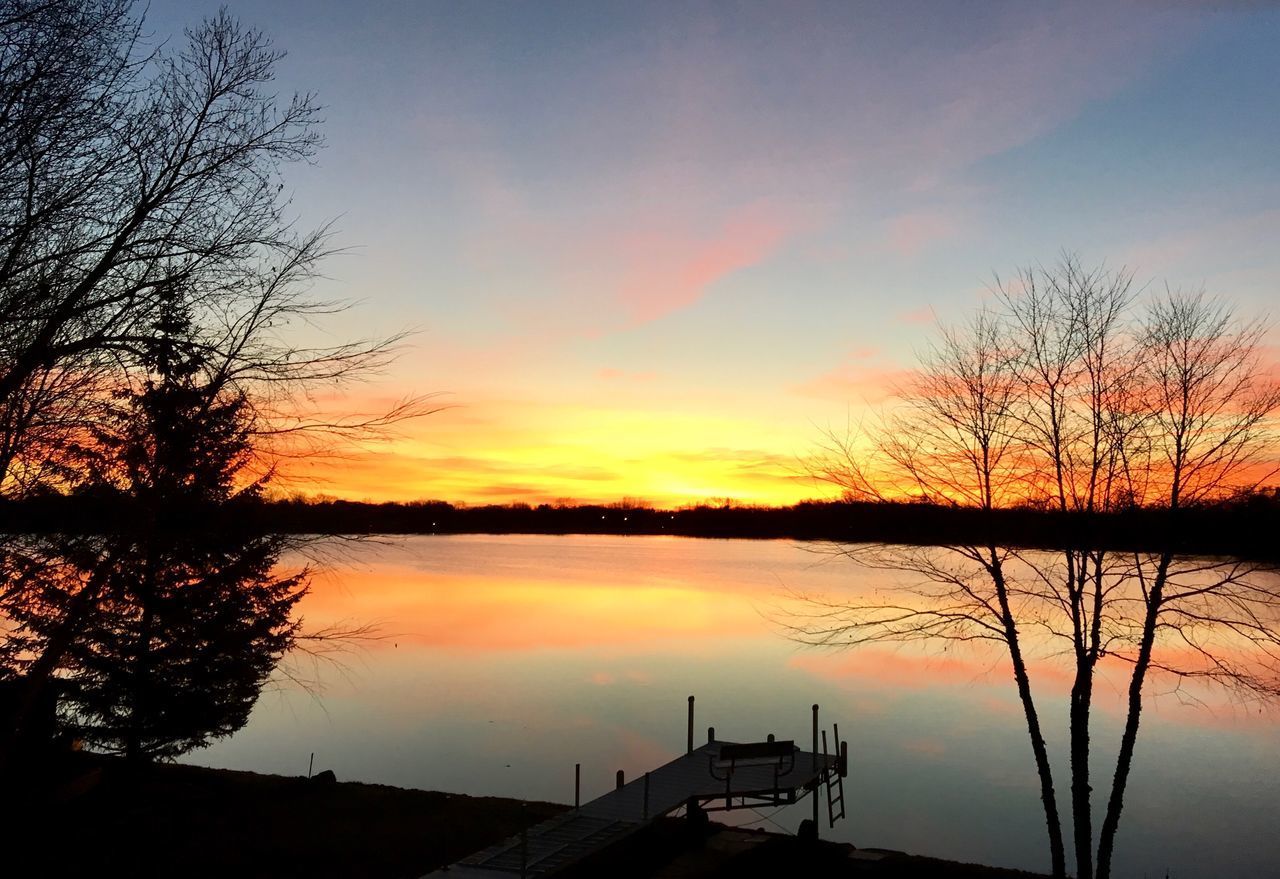 SCENIC VIEW OF LAKE AGAINST ORANGE SKY