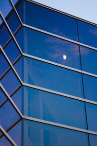 Low angle view of blue sky with windows