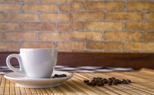 Close-up of coffee cup on table