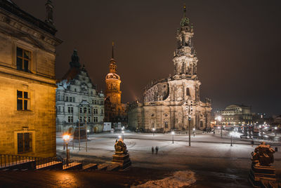 Illuminated buildings in city at night