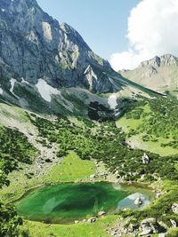 Scenic view of landscape and an alpine mountain lake