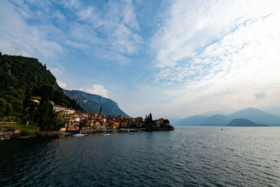 Scenic view of sea against sky in city