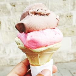 Close-up of hand holding ice cream