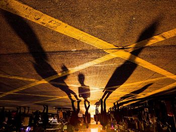 Shadow of people on street