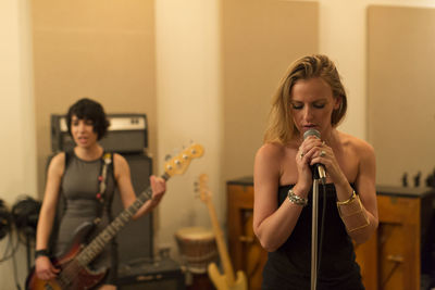 Young musicians practicing at a rehearsal space