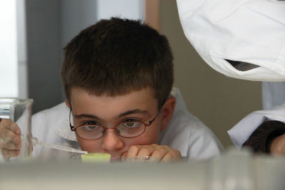 Portrait of boy working in science lab