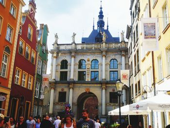 Group of people in front of buildings in city