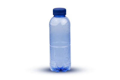 Close-up of glass bottle against white background