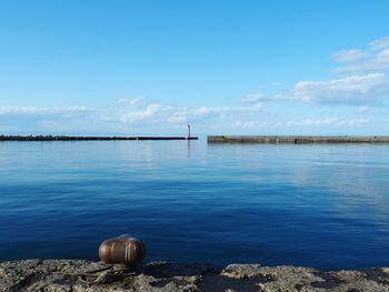 Scenic view of sea against blue sky