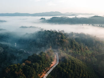 High angle view of trees and mountains against sky