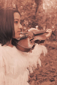 Portrait of a young woman playing
