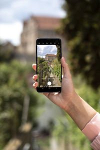 Human hand holding smart phone