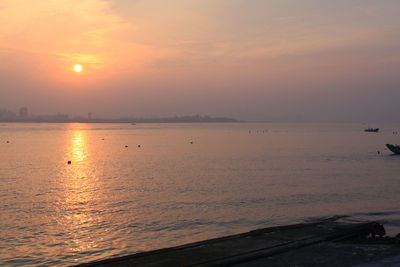 Scenic view of sea against sky during sunset