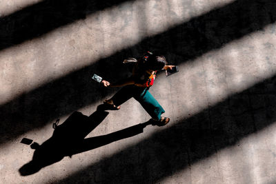 High angle view of man on street in city