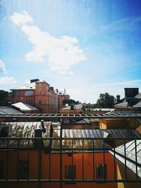 Low angle view of building against cloudy sky