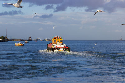 Boat in sea against sky