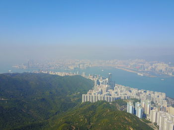 Aerial view of cityscape against clear sky