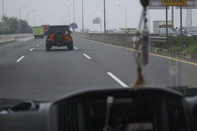 Car on road during rainy season