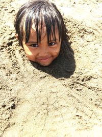 Portrait of boy on sand