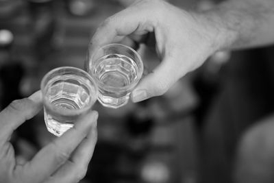 Close-up of hand holding glass