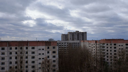 Buildings in city against sky