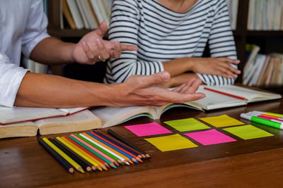 Low section of people on table