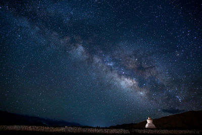 Scenic view of star field against sky at night