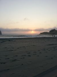 View of beach at sunset