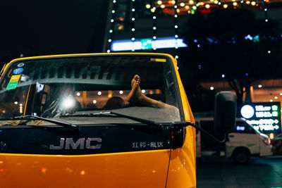 Vintage car on illuminated street at night