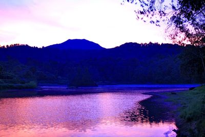 Scenic view of lake against sky during sunset