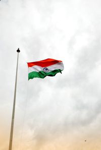 Low angle view of flag against sky