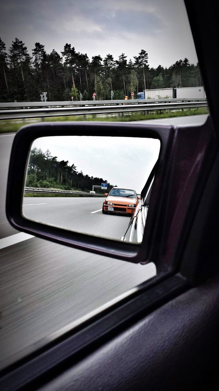 transportation, mode of transport, car, vehicle interior, land vehicle, window, glass - material, transparent, tree, side-view mirror, car interior, reflection, travel, road, looking through window, sky, windshield, indoors, close-up, day