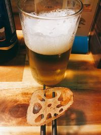 Close-up of beer glass on table