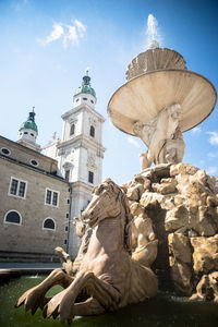 Low angle view of statue against building