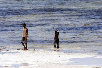 Woman standing on beach