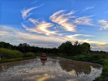 Scenic view of land against sky during sunset