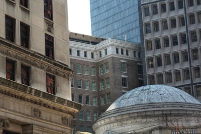 Low angle view of modern buildings in city