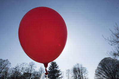 Low angle view of balloons against sky