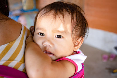 Portrait of cute baby at home