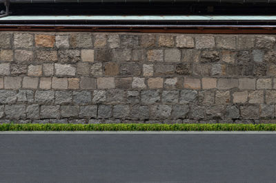 View of street against wall