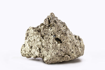 Close-up of rock against white background