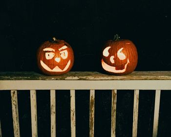 Close-up of pumpkin on railing