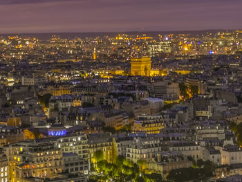 High angle view of illuminated city buildings at night