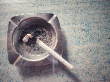 High angle view of cigarette on table