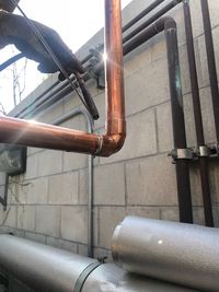 Close-up of pipe against water