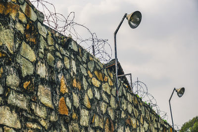 Low angle view of street light against sky