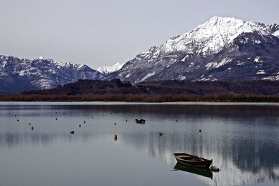 Scenic view of lake with mountains in background