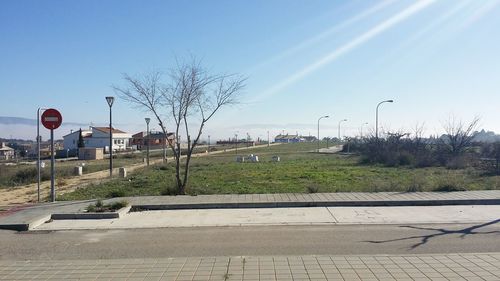 Road in city against clear sky